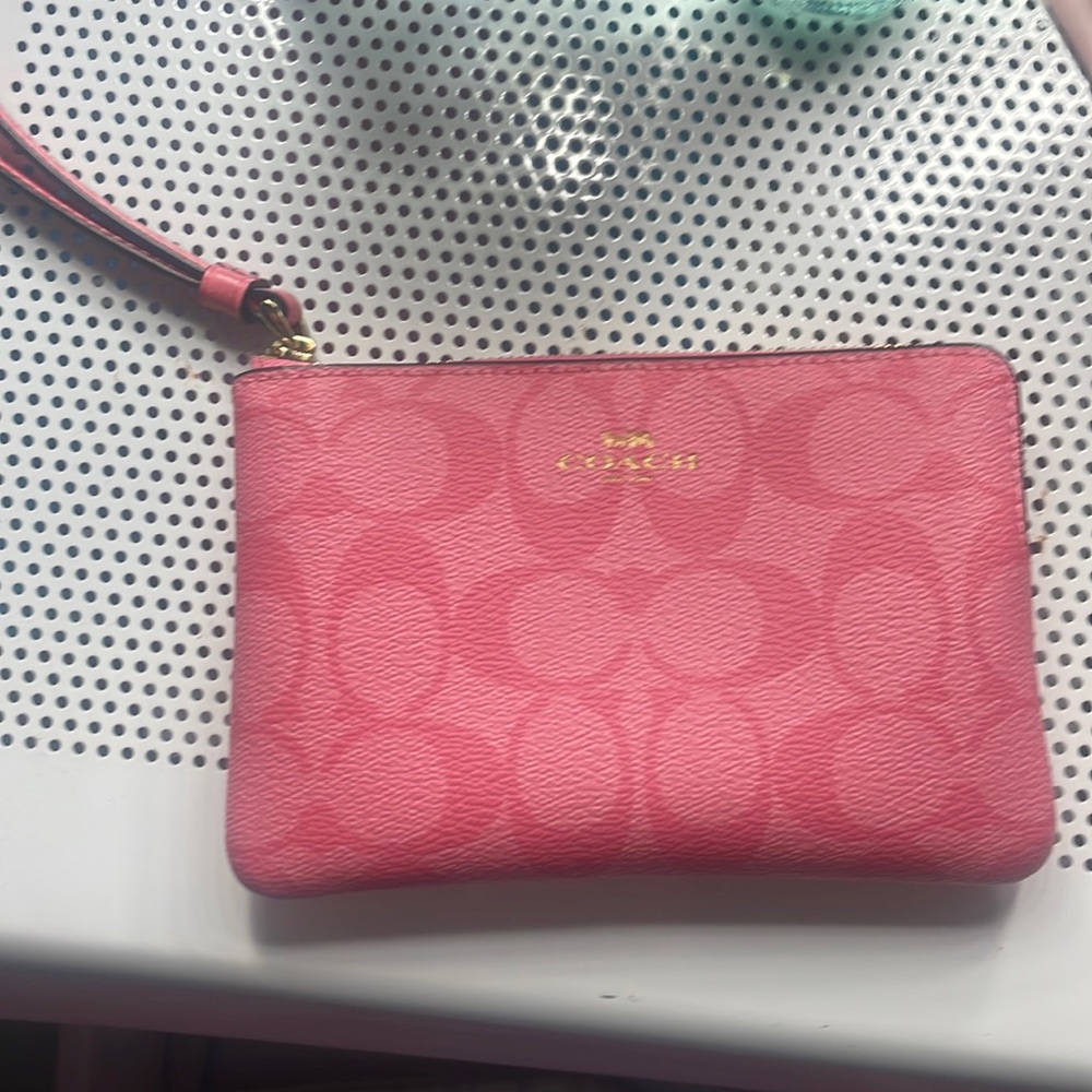 Coach pink lemonade wristlet.